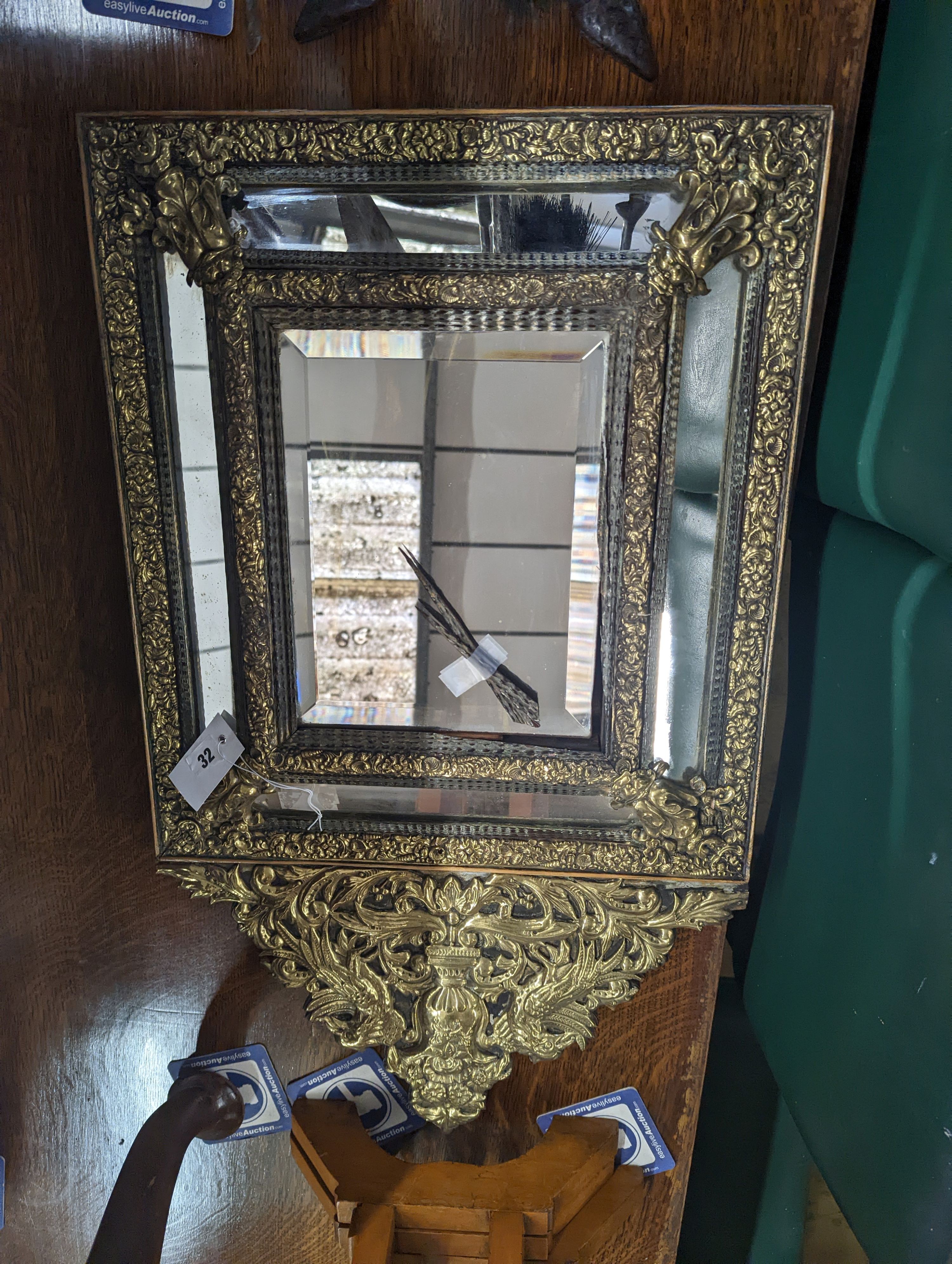 A 19th century Dutch embossed brass wall mirror, width 45cm, height 75cm